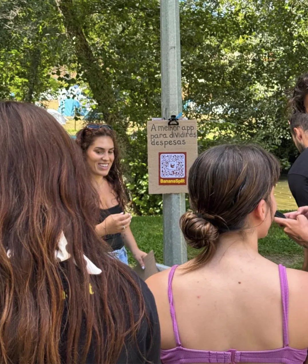 People gathered beside the BananaSplit sign in Paredes de Coura
